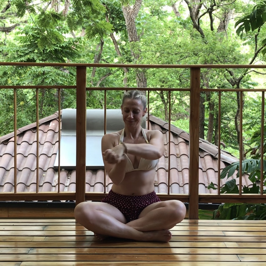 Julie Sinner doing a wrist stretch