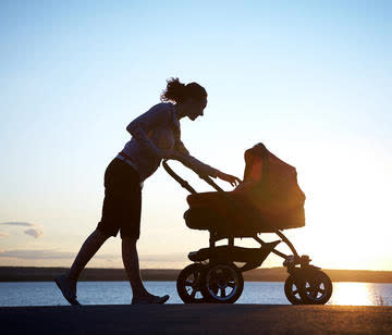 Woman walking with a stroller